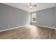 This bedroom has a ceiling fan and hardwood floors at 261 Silver Ridge Dr, Dallas, GA 30157