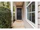 Inviting front entrance with a classic black door and a welcoming mat at 261 Silver Ridge Dr, Dallas, GA 30157