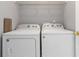 Laundry room featuring a white washing machine and dryer at 261 Silver Ridge Dr, Dallas, GA 30157