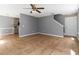 Open concept living room with tile flooring and a modern ceiling fan at 261 Silver Ridge Dr, Dallas, GA 30157