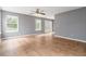 Spacious living room with tile flooring, ceiling fan and access to backyard patio at 261 Silver Ridge Dr, Dallas, GA 30157