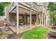 Charming backyard patio with stone flooring, outdoor seating, and a well-maintained lawn at 325 Valley Brook Way, Atlanta, GA 30342