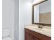 Cozy bathroom with a decorative framed mirror, warm-toned vanity and sink, and a tiled shower at 325 Valley Brook Way, Atlanta, GA 30342