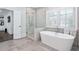 Bathroom with a soaking tub and glass-enclosed shower at 325 Valley Brook Way, Atlanta, GA 30342