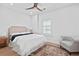 Bright bedroom with a comfortable bed, a decorative rug, and a chair for a cozy retreat at 325 Valley Brook Way, Atlanta, GA 30342