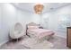 Cozy bedroom with unique egg chair and stylish chandelier at 325 Valley Brook Way, Atlanta, GA 30342