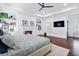 Spacious main bedroom features a fireplace, tray ceiling, built-in bookshelves, and hardwood floors at 325 Valley Brook Way, Atlanta, GA 30342