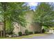 Side view of a traditional two-story house with lots of trees, blending into the surrounding neighborhood at 325 Valley Brook Way, Atlanta, GA 30342