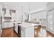 Bright kitchen with a spacious island, stainless steel appliances, and an open layout, ideal for entertaining and Gathering life at 325 Valley Brook Way, Atlanta, GA 30342