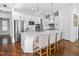 Modern kitchen featuring a large island with seating, stainless steel appliances, and custom cabinetry, great for cooking at 325 Valley Brook Way, Atlanta, GA 30342