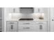 Well-lit kitchen features ample white cabinetry, subway tile backsplash, and modern stainless steel appliances at 325 Valley Brook Way, Atlanta, GA 30342