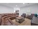 Inviting living room with leather furniture, a wooden coffee table, and natural light from the window at 325 Valley Brook Way, Atlanta, GA 30342