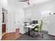 Light-filled office with a ceiling fan features a door to an attached bathroom and two windows at 325 Valley Brook Way, Atlanta, GA 30342
