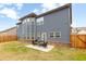 Backyard featuring a gray house with a patio and furniture at 4824 Sultana Sw Way, Atlanta, GA 30331