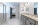 Bathroom featuring marble floors and granite countertop with a view into the primary bedroom at 4824 Sultana Sw Way, Atlanta, GA 30331