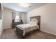 Cozy bedroom with a plush bed, soft carpet, and dresser providing a relaxing and comfortable retreat at 4824 Sultana Sw Way, Atlanta, GA 30331