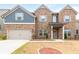 Charming two-story brick home with a two-car garage and well-manicured lawn, offering classic suburban appeal at 4824 Sultana Sw Way, Atlanta, GA 30331