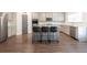 Contemporary kitchen with stainless steel appliances, a center island with bar stools, and sleek gray cabinets at 4824 Sultana Sw Way, Atlanta, GA 30331
