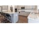 Stylish kitchen featuring granite countertops, stainless steel appliances, and a center island with bar seating at 4824 Sultana Sw Way, Atlanta, GA 30331