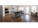 Modern kitchen featuring stainless steel appliances, a center island with seating, and ample cabinet space at 4824 Sultana Sw Way, Atlanta, GA 30331