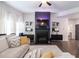 Bright living room with dark wood floors, fireplace, and stylish decor for modern comfort and entertaining at 4824 Sultana Sw Way, Atlanta, GA 30331
