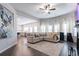 Inviting living room features a comfortable sectional sofa, large windows, and an open layout to the kitchen at 4824 Sultana Sw Way, Atlanta, GA 30331