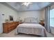 Bedroom featuring neutral walls, neutral carpet and a light filled window with curtains at 537 Rendezvous Rd, Acworth, GA 30102