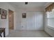 View of a carpeted bedroom with white trim, white closet doors and a window at 537 Rendezvous Rd, Acworth, GA 30102