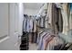 Walk-in closet providing ample storage with shelving and hanging space for clothing and accessories at 537 Rendezvous Rd, Acworth, GA 30102