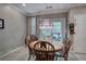 Dining room with a traditional chandelier and sliding glass door at 537 Rendezvous Rd, Acworth, GA 30102