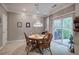 Cozy dining room featuring a vintage chandelier and a sliding glass door to the backyard at 537 Rendezvous Rd, Acworth, GA 30102