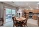 Dining room with view into kitchen and a glass door to the exterior at 537 Rendezvous Rd, Acworth, GA 30102