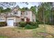 Attractive townhome featuring a manicured lawn and beautiful landscaping at 537 Rendezvous Rd, Acworth, GA 30102