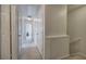 Hallway featuring neutral-toned walls, carpeted floor, and a series of white doors creating a clean and bright path at 537 Rendezvous Rd, Acworth, GA 30102