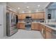 Spacious kitchen features stainless steel appliances and plenty of cabinets for storage at 537 Rendezvous Rd, Acworth, GA 30102