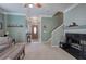 Comfortable living room featuring a fireplace and staircase at 537 Rendezvous Rd, Acworth, GA 30102