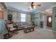 Comfortable living room with neutral walls, plush carpeting, and a variety of seating options at 537 Rendezvous Rd, Acworth, GA 30102