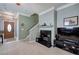 Cozy living room features a fireplace with a marble hearth and a staircase leading to the upper level at 537 Rendezvous Rd, Acworth, GA 30102