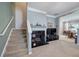 Inviting living room with stairs and an adjacent dining area at 537 Rendezvous Rd, Acworth, GA 30102