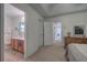 Main bedroom with ensuite bath, neutral walls, carpet and a light filled bedroom at 537 Rendezvous Rd, Acworth, GA 30102