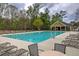 Community pool with lounge chairs surrounded by lush greenery at 537 Rendezvous Rd, Acworth, GA 30102