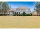 The backyard boasts a spacious lawn and manicured landscaping, enhancing the home's appeal at 8450 Sundial Ct, Johns Creek, GA 30024