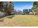 A large backyard with mature trees offers ample space and privacy at 8450 Sundial Ct, Johns Creek, GA 30024