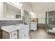 Spacious bathroom with marble countertops, double vanities, and a glass-enclosed shower at 8450 Sundial Ct, Johns Creek, GA 30024