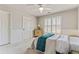 Cozy bedroom with wainscoting, shuttered windows, and ample natural light at 8450 Sundial Ct, Johns Creek, GA 30024