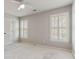 Bright bedroom with plantation shutters and neutral color scheme at 8450 Sundial Ct, Johns Creek, GA 30024