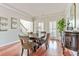 Elegant dining room with hardwood floors and natural lighting with classic furnishings at 8450 Sundial Ct, Johns Creek, GA 30024