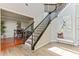 Bright entryway with a staircase, hardwood floors, and elegant decor at 8450 Sundial Ct, Johns Creek, GA 30024