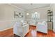 Cozy living room with hardwood floors, stylish furniture, and natural light at 8450 Sundial Ct, Johns Creek, GA 30024