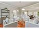 Comfortable living room with hardwood floors, neutral seating, and modern decor at 8450 Sundial Ct, Johns Creek, GA 30024
